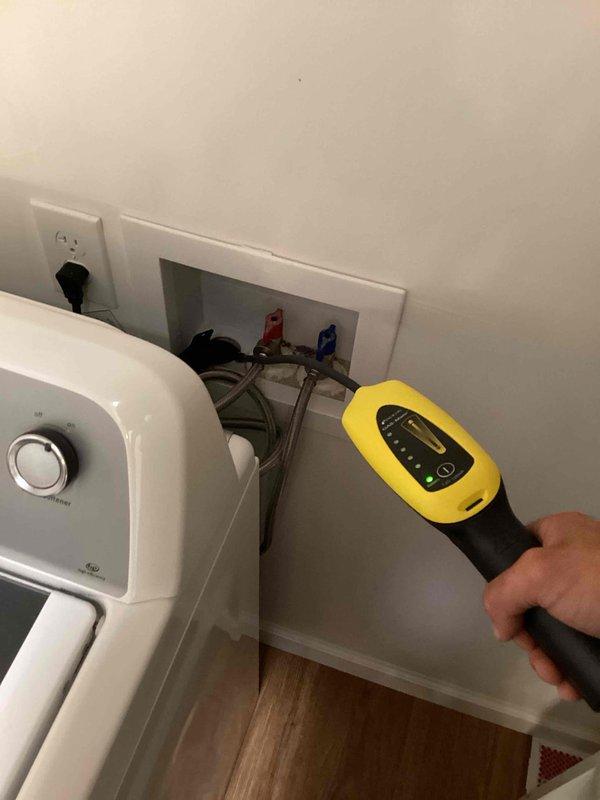 Responded to service call for persistent sewer odor in residential property. Customer had previously replaced toilet wax ring without resolving the issue. Conducted diagnostic inspection of plumbing system using gas detection equipment to identify source of sewer smell. Inspected accessible plumbing connections behind water heater, including water supply lines, shut-off valves, and drain piping in utility area. Performed measurements and readings with handheld diagnostic meter to assess potential sewer gas leaks or venting issues. Provided estimate for sewer line repair work based on findings from inspection and diagnostic testing.