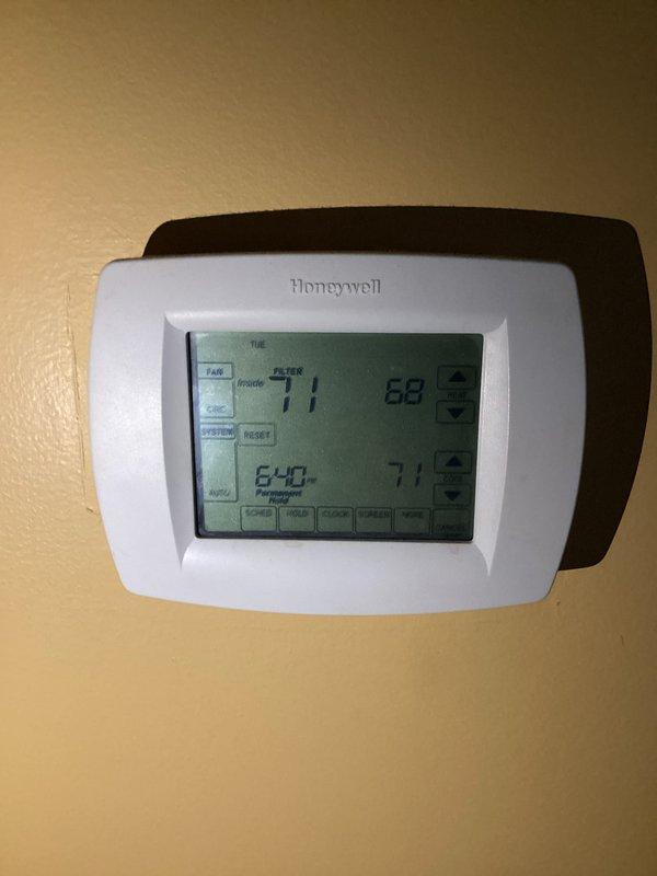 Completed basic monthly heating maintenance visit on residential HVAC system. Performed standard inspection of heating equipment and verified thermostat operation. Honeywell programmable thermostat confirmed functioning properly with display showing temperature settings and permanent hold mode active. Inspected 50-gallon electric water heater (Model XE50T12CS55U1) with dual 5500-watt heating elements rated for 240V operation, verified all manufacturer labels and safety warnings intact and legible. All components operating within normal parameters with no issues identified requiring immediate attention.