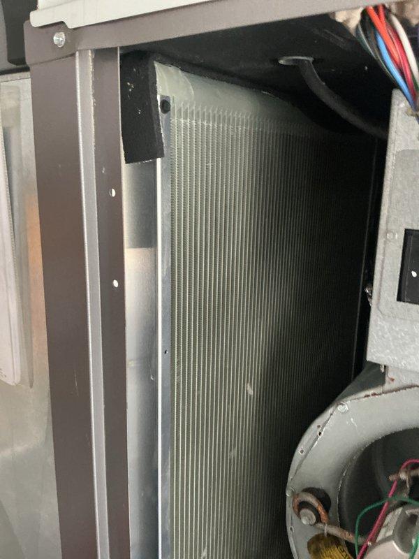 Completed annual heating maintenance visit under active comfort care plan. Performed comprehensive system inspection of indoor air handler unit, verified evaporator coil cleanliness and proper airflow through aluminum fin assembly, checked blower motor operation and electrical connections, and inspected ductwork installation and penetrations in mechanical area. System components found in good operating condition with no immediate repairs required.
