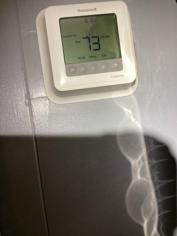 Completed comprehensive cooling and heating maintenance service on Honeywell ProSeries thermostat system. Performed standard monthly maintenance inspection, verified thermostat operation and temperature control functionality, and documented system settings showing unit maintaining 73°F ambient temperature with 75°F setpoint in cooling mode with auto fan operation. Customer-supplied 20X20X5 filter not included in this basic monthly maintenance visit.
