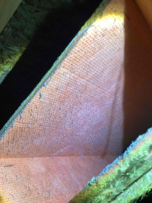 Conducted initial diagnostic evaluation of HVAC system with inadequate cooling performance. Identified multiple deficiencies in ductwork system including damaged supply vents with visible holes and displaced duct sections affecting airflow distribution. Observed significant frost accumulation on refrigerant line indicating possible airflow restriction or refrigerant issue. Documented conditions with photos showing ice buildup on copper piping and compromised duct insulation in attic space. Recommended comprehensive duct evaluation and repairs to restore proper system operation and cooling efficiency. Follow-up appointment required to complete ductwork assessment and perform necessary repairs.