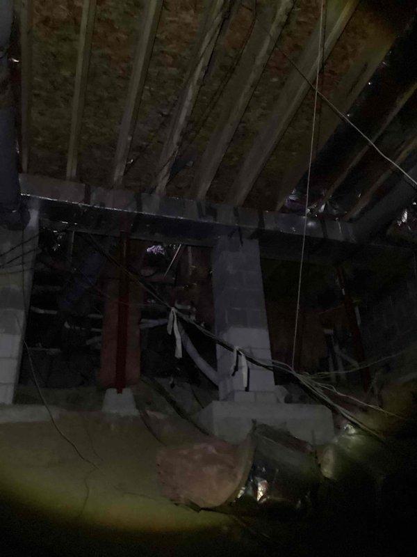 Conducted initial diagnostic evaluation of HVAC system with inadequate cooling performance. Identified multiple deficiencies in ductwork system including damaged supply vents with visible holes and displaced duct sections affecting airflow distribution. Observed significant frost accumulation on refrigerant line indicating possible airflow restriction or refrigerant issue. Documented conditions with photos showing ice buildup on copper piping and compromised duct insulation in attic space. Recommended comprehensive duct evaluation and repairs to restore proper system operation and cooling efficiency. Follow-up appointment required to complete ductwork assessment and perform necessary repairs.