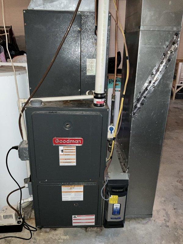 Conducted comprehensive system evaluation following previous refrigerant leak repair attempt at indoor coil. Inspection revealed extensive corrosion and rust damage to indoor coil, heat exchanger showing significant wear and overheating concerns, and overall system deterioration due to age. Provided full HVAC system replacement estimate for Goodman furnace and Amana outdoor condensing unit.