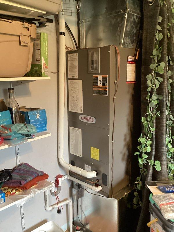 Completed annual cooling maintenance visit on Lennox air handler system. Performed standard inspection of blower assembly, noting significant rust and corrosion on central motor shaft requiring future monitoring. Observed aged ductwork with surface discoloration but functionally intact. Replaced 14x24x1 air filter as included in service. Verified blower wheel operation and airflow through metallic supply ductwork. System operational at time of departure, though motor shaft corrosion should be addressed during next service interval to prevent potential bearing failure.