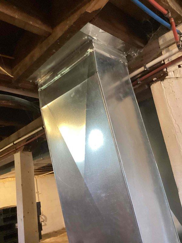 Completed free estimate for duct cleaning services at recently purchased residence with previous pet occupancy. Inspected basement HVAC ductwork system including main trunk lines and galvanized metal supply ducts mounted between floor joists. Assessed condition of ductwork for pet dander, hair accumulation, and potential contamination from previous animal occupants to provide comprehensive cleaning recommendation.