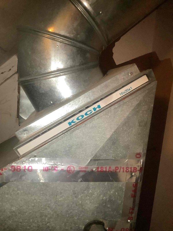 Completed monthly maintenance on Carrier air handler unit and cooling system. Inspected ductwork components including KOCH filter grille assembly, verified condensate drainage system with PVC piping and Defender drain pan treatment device operational. System operating within normal parameters; unable to verify filter size for future reference.