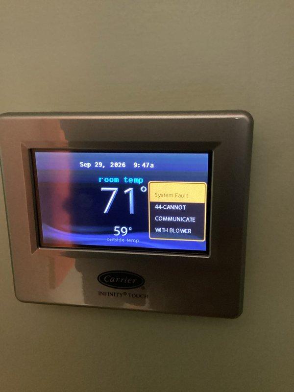 Responded to system fault 44 communication error on Carrier Infinity system. Diagnosed blower motor communication failure indicated by active fault codes on thermostat display showing inability to communicate with blower motor and blower motor fault occurring 24 consecutive times.