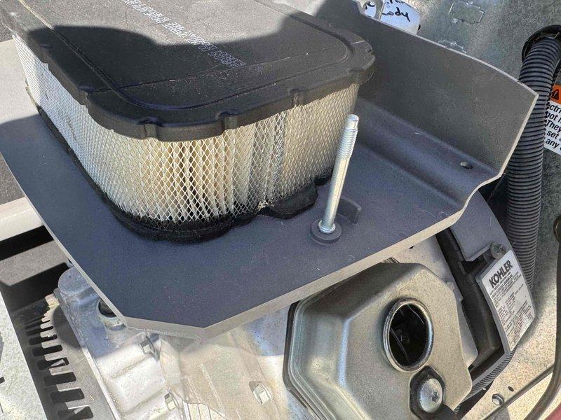 Performed routine preventive maintenance on Kohler engine generator unit. Inspected air filter assembly and engine components for proper operation, verified electrical output readings using digital multimeter, and confirmed all systems functioning within normal parameters.