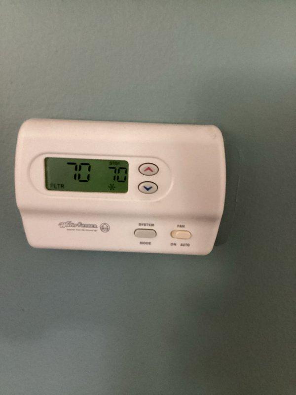 Responded to service call for geothermal heat pump system displaying flashing high pressure fault light upon first heating cycle activation. System defaulted to stage 2 auxiliary heat element instead of operating in geothermal mode. Inspected thermostat settings and confirmed proper temperature display and control functionality. Evaluated system pressure readings using diagnostic gauge to assess refrigerant circuit operation and identify cause of high pressure fault condition.