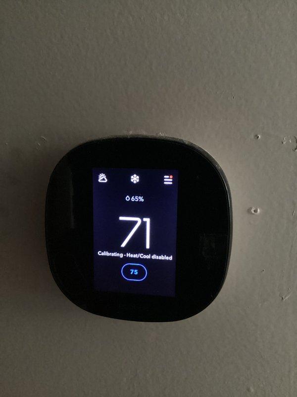 Responded to communication fault on 12-year-old Trane HVAC system displaying LED flash codes 10 (top) and 11 (bottom). Diagnosed communication error between thermostat and air handler, performed system reset and recalibration procedures. Verified thermostat functionality and restored proper heat/cool operation with system communicating correctly upon completion.