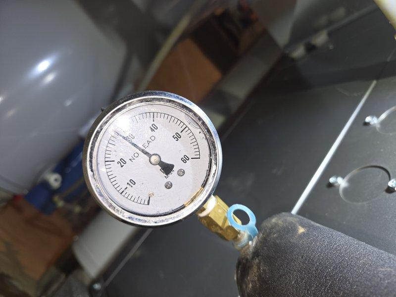 Conducted diagnostic assessment of HVAC system pumps and pressure monitoring equipment. Inspected pressure gauges reading 0-60 PSI range on mechanical equipment to verify system operation and identify wiring deficiencies. Documented current system conditions with pressure readings near zero, indicating pumps require electrical rewiring to restore proper functionality. Return visit scheduled to complete pump rewiring and restore system to full operational capacity.