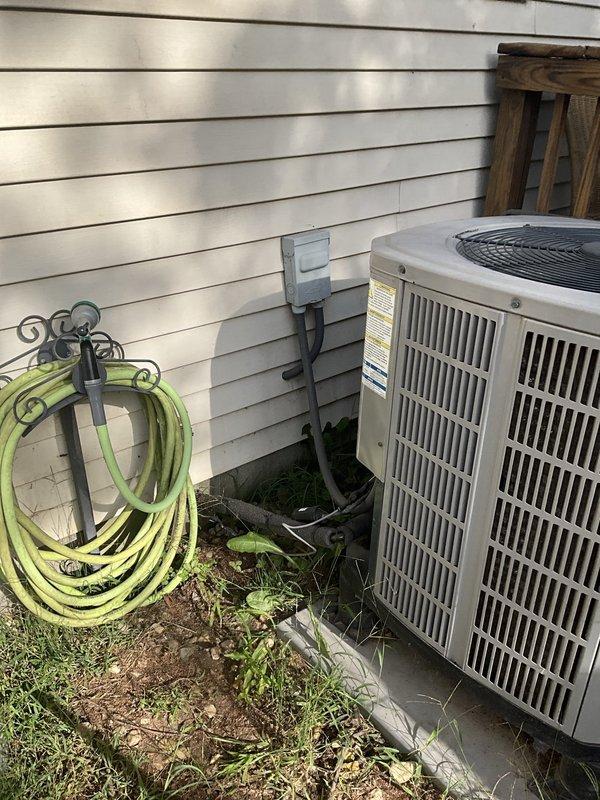 Conducted site evaluation for complete HVAC system replacement. Customer requested estimate for relocating air handler from crawl space to attic installation, including new ductwork throughout and replacement outdoor condensing unit. Alternative estimate provided for full system replacement maintaining existing equipment locations. Documented current outdoor unit condition showing vegetation encroachment and assessed interior access points for potential attic installation routing.