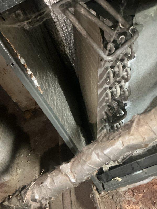 Completed comprehensive heating maintenance tune-up on 11-year-old HVAC system. Inspected evaporator coil assembly showing dust accumulation and age-related wear, verified copper tube grid integrity and refrigerant line connections. Examined air handler unit with minor surface corrosion but confirmed operational functionality. Assessed insulated refrigerant lines showing deterioration of external wrapping. Replaced air filters with new 20x20x1 pleated units to ensure proper airflow and system efficiency for the heating season.