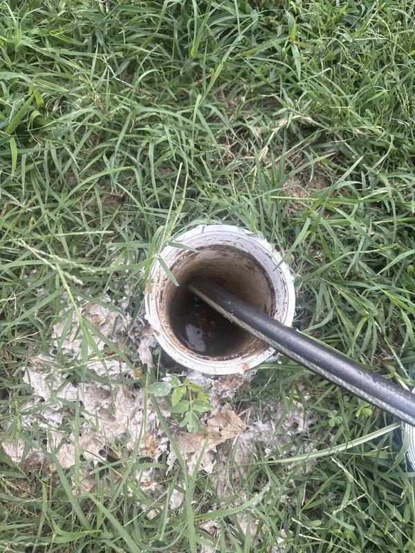Responded to sewer backup concern and verified scope of previous installation work. Conducted camera inspection of sewer line from cleanout to verify extent of pipe replacement. Documentation confirmed line was replaced from building connection to street main, not terminating at sidewalk as reported. Interior pipe inspection showed clean, new PVC construction with no obstructions or buildup throughout entire run. Exterior cleanout access point verified at property line with proper connection to municipal system. Communicated findings regarding complete installation scope and addressed discrepancy between tenant observation and actual work performed.