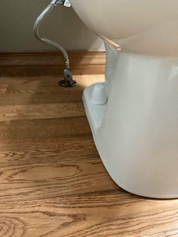 Responded to service call for toilet leak suspected to originate from failed wax ring seal. Upon inspection, confirmed active leak at base of toilet where fixture meets floor flange. Removed toilet from mounting flange, verified deteriorated wax ring as source of water intrusion onto hardwood flooring. Replaced defective wax ring with new seal, reinstalled toilet to proper specifications, and tested water supply line connections for integrity. Verified repair eliminated leak and restored proper function.