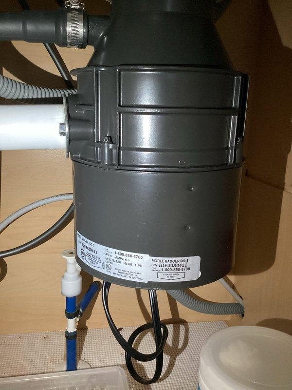 Completed monthly plumbing inspection for membership service. Performed comprehensive assessment of kitchen and bathroom plumbing fixtures, including garbage disposal unit under kitchen sink and jetted whirlpool tub with wall-mounted controls. Documented all visible plumbing connections, supply lines, drainage systems, and fixture conditions through photographic record for maintenance tracking purposes.