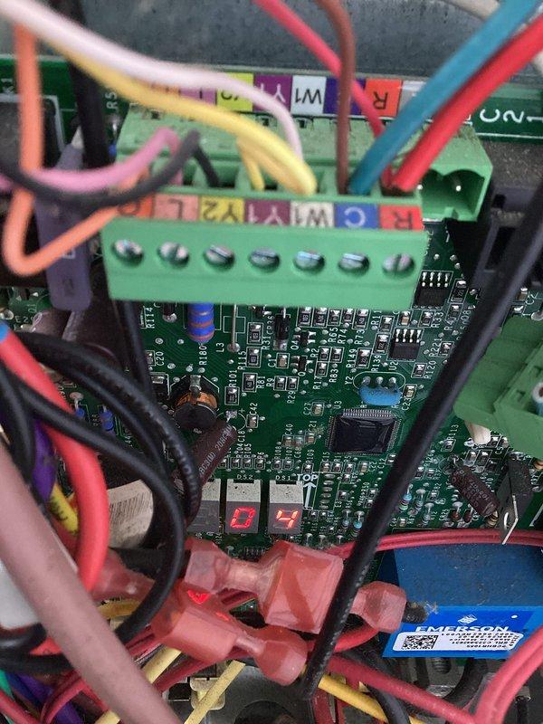 Responded to intermittent cooling failure with unit cycling off and blowing warm air. Diagnosed faulty control board with error code displayed on LED panel. Replaced defective circuit board assembly, verified proper wire connections at terminal block, and tested system operation to confirm normal cooling cycle restored.
