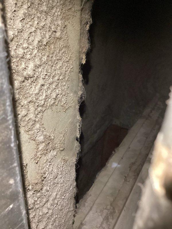 Completed annual heating maintenance on 11-year-old furnace system. Performed comprehensive tune-up including inspection of evaporator coil assembly, copper refrigerant lines, and ductwork components. Noted significant dust and debris accumulation on metal ductwork surfaces and HVAC components throughout system. Inspected evaporator coil with aluminum fins and U-bend copper tubing configuration, observing age-appropriate oxidation and patina on copper surfaces. Verified electrical connections and wiring integrity at air handler unit. All components found operational during inspection, with system showing normal wear patterns consistent with age and service history.