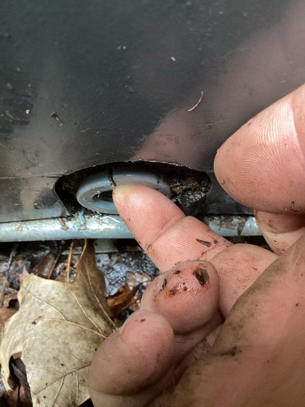 Responded to no-heat call on 3-year-old heat pump system located in utility closet. Upon arrival, found outdoor condenser unit heavily obstructed by overgrown vegetation and debris accumulation around unit and refrigerant line penetrations. Cleared vegetation from around equipment, cleaned debris from condenser coils and line set connections, and restored proper airflow clearance. Cycled system successfully and verified normal operation with proper heating output.