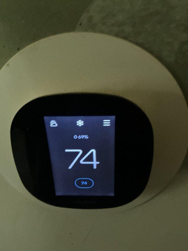 # HVAC Maintenance Summary

Completed basic monthly heating system maintenance visit on residential HVAC system. Performed standard inspection of Bryant heating and cooling equipment, verified thermostat operation showing 74°F setpoint with proper digital display function, and confirmed outdoor condenser unit condition with adequate clearance and airflow through louvered panels.

# Detailed Service Report

Performed comprehensive basic monthly heating maintenance service on residential HVAC system as part of recurring preventative maintenance program. Service included 14x14x1 filter replacement and standard heating system inspection protocols.

**Thermostat Inspection:**
Verified operation of digital smart thermostat mounted in living space. Confirmed display functionality showing current temperature reading of 74°F with humidity level at 69%. Checked user interface responsiveness and menu navigation. Verified fan control, system mode settings, and programming functions operating withi