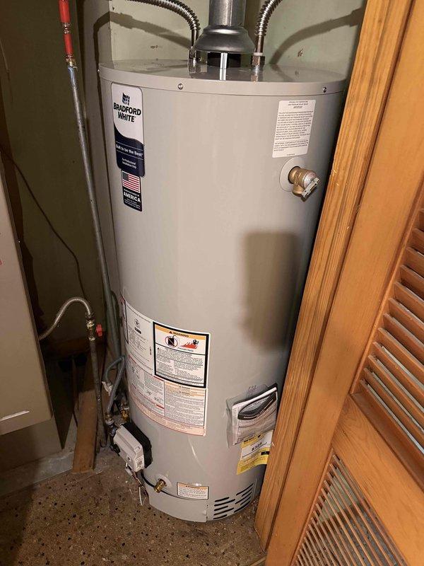 Responded to service call for no hot water condition on Bradford White tanked water heater. Upon arrival, confirmed pilot light was extinguished and unit was not producing hot water. Inspected Honeywell gas control valve and burner assembly, verified gas supply was available to unit, and successfully relit pilot light following manufacturer specifications. Tested unit operation to ensure proper ignition sequence and burner function, confirmed hot water production was restored, and documented equipment condition with photographs for service records.