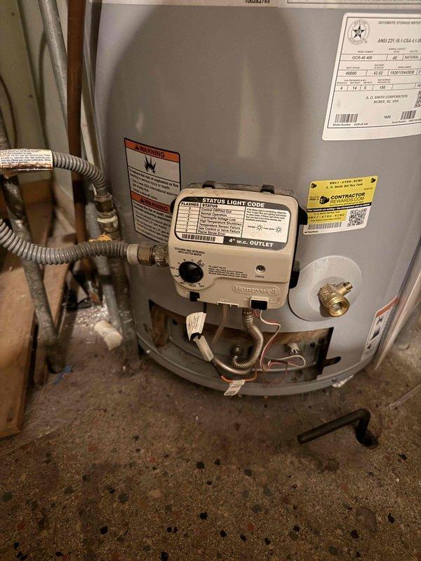 Responded to service call for no hot water condition on Bradford White tanked water heater. Upon arrival, confirmed pilot light was extinguished and unit was not producing hot water. Inspected Honeywell gas control valve and burner assembly, verified gas supply was available to unit, and successfully relit pilot light following manufacturer specifications. Tested unit operation to ensure proper ignition sequence and burner function, confirmed hot water production was restored, and documented equipment condition with photographs for service records.