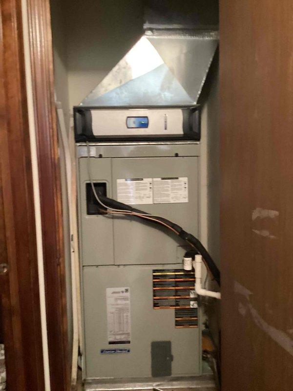 Completed monthly recurring heating maintenance on residential HVAC system. Inspected indoor air handler unit with integrated heating components and verified proper operation of digital thermostat controls. Examined outdoor heat pump unit positioned on concrete pad, confirmed unit integrity and verified refrigerant lines are secure with no visible leaks or damage.