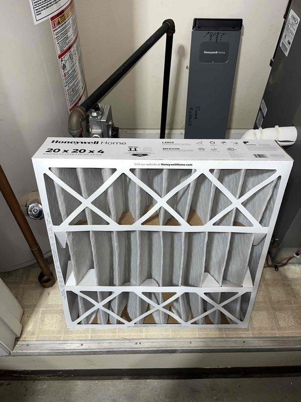 Completed scheduled heating maintenance on residential HVAC system. Replaced 20x25x4 air filter with new Honeywell Home unit and inspected evaporator coil assembly, which showed normal frost accumulation and proper refrigeration operation. Verified all system components including control board, refrigerant lines, and brass valve connections were functioning correctly with no issues identified.