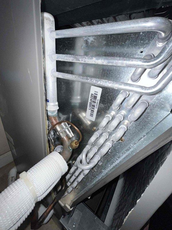 Completed scheduled heating maintenance on residential HVAC system. Replaced 20x25x4 air filter with new Honeywell Home unit and inspected evaporator coil assembly, which showed normal frost accumulation and proper refrigeration operation. Verified all system components including control board, refrigerant lines, and brass valve connections were functioning correctly with no issues identified.