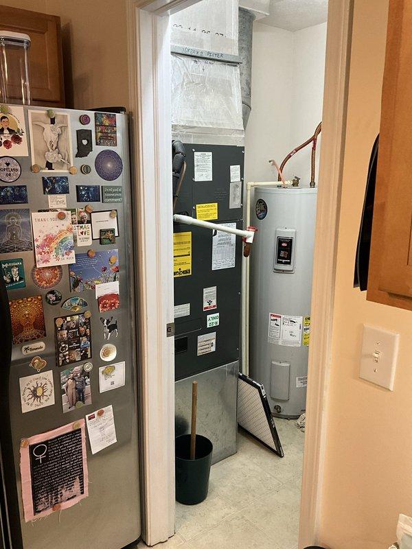 Conducted comprehensive comfort advisor consultation for complete HVAC system replacement. Evaluated existing 20-year-old air conditioning condenser unit located on exterior gravel pad with electrical disconnect, and 20-year-old furnace/air handler installed in interior utility closet with vertical ductwork configuration. Documented current equipment conditions through photographic assessment of both indoor and outdoor components. Assessed system layout, existing infrastructure, and replacement requirements. Provided detailed equipment replacement options and recommendations for full system upgrade including both heating and cooling units.