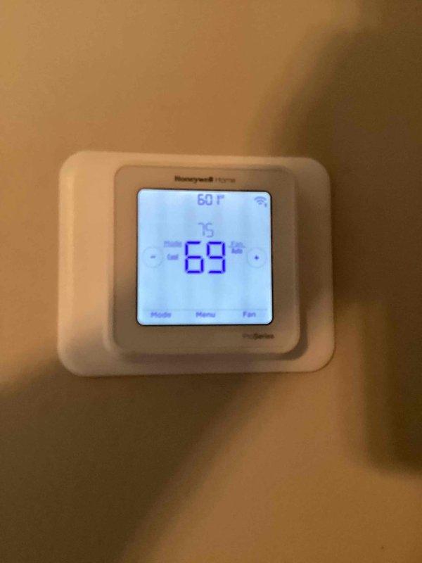 Completed annual basic heating maintenance visit on Lennox furnace system located in basement utility area. Performed standard heating season inspection including visual inspection of unit, heat exchanger, burner assembly, and all safety controls. Installed customer-provided 20x25x4 air filter as part of active comfort care plan. Verified thermostat operation showing system maintaining 69°F setpoint with proper communication to heating equipment. Inspected gas connections, condensate drainage system with PVC piping, and all electrical connections for proper operation. All components found operating within normal parameters with no immediate service needs identified. System ready for heating season operation.