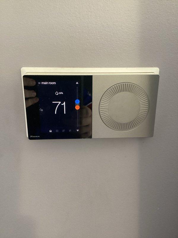 Completed monthly basic heating maintenance visit on Daikin HVAC system. Performed standard system inspection, verified thermostat operation showing 71°F setpoint with 59% humidity reading, and inspected outdoor condenser unit noting dirt accumulation on top surface. Customer to provide 20x25x4 filter for replacement as it is not included in this service plan.