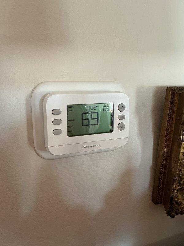 Completed monthly CCH maintenance visit. Replaced 16x20x1 air filter which showed moderate dust and debris accumulation. Verified thermostat operation and display functionality showing proper temperature readings at 69°F setpoint. System operating within normal parameters.