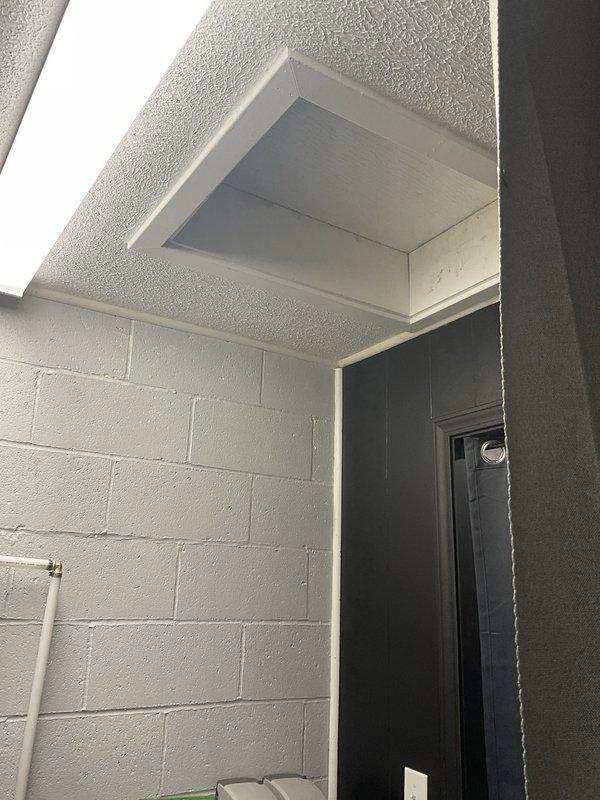 Conducted site assessment for mini split installation at commercial café space. Evaluated interior layout including ceiling structure with gray tile pattern, multiple skylights, and existing HVAC infrastructure. Documented entry area with concrete block walls and identified optimal placement zones for indoor air handler units and outdoor condensing unit connections. Provided estimate for ductless mini split system to enhance climate control in customer seating areas while maintaining aesthetic integration with contemporary café design.