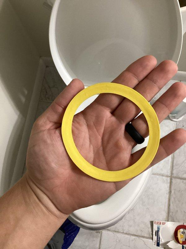 Responded to a non-functioning toilet that was unable to flush. Upon inspection, diagnosed a failed flush valve seal causing improper water release from the tank. Removed the old deteriorated flush valve gasket and replaced it with a new yellow rubber seal. Verified the fill valve assembly was operating correctly and inspected tank interior for any additional issues. Tested flush mechanism multiple times to confirm proper operation and complete water evacuation from tank to bowl. Toilet restored to full working condition.