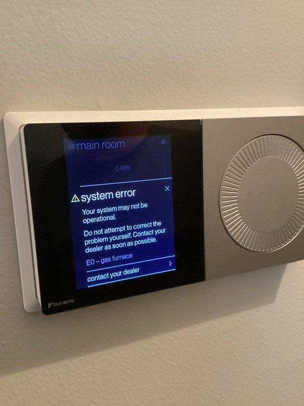 Responded to no heat call on 5-year-old Daikin gas furnace. Upon arrival, thermostat displayed system error code E0 indicating gas furnace fault. Opened furnace control panel and diagnosed issue with gas valve assembly and control board communication. Repaired electrical connections, reset system, and verified proper furnace operation with normal heating restored.