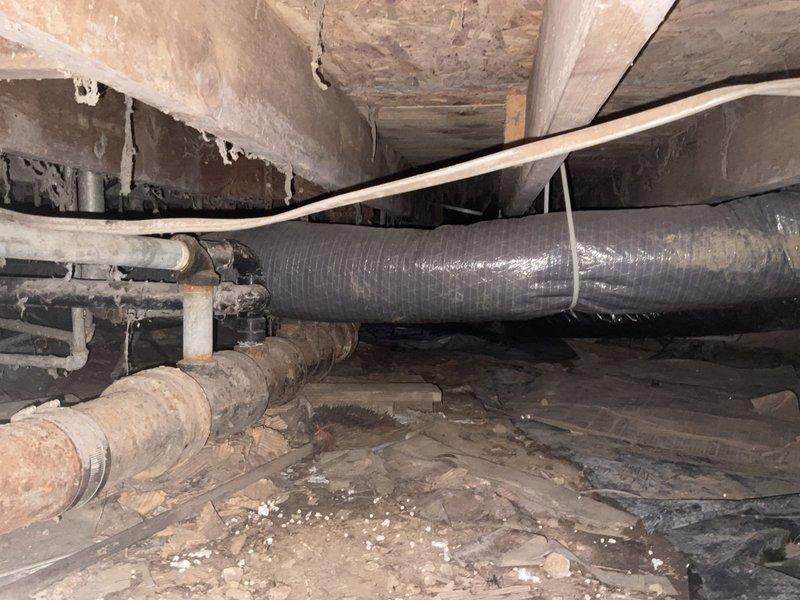 Conducted comprehensive assessment of existing ductwork system located in crawlspace with exterior access. Inspection revealed deteriorated flexible ductwork with significant water accumulation and compromised airflow throughout the residence. Evaluated crawlspace conditions including aged infrastructure, moisture exposure, and accessibility constraints. Documented current HVAC installation including furnace unit, PVC venting system, and existing duct runs. Provided estimate for complete ductwork replacement to restore proper air distribution and eliminate water intrusion issues affecting system performance.