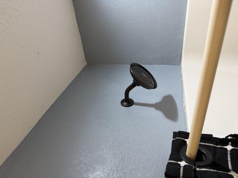 Replaced defective shower valve assembly in residential bathroom. Shut off water supply, removed old valve cartridge, installed new valve mechanism, and restored water service. Tested operation to ensure proper hot and cold water control and verified no leaks at connections.