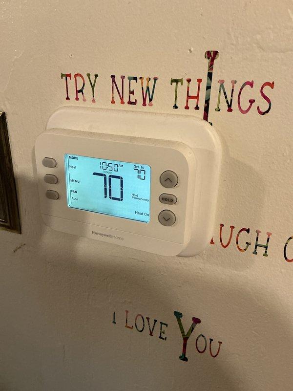 Completed annual heating maintenance visit after 4:30 PM. Performed comprehensive system inspection and installed new 20x25x4 air filter. Verified thermostat operation showing proper heating function at 70 degrees setpoint with system responding correctly to temperature demands.