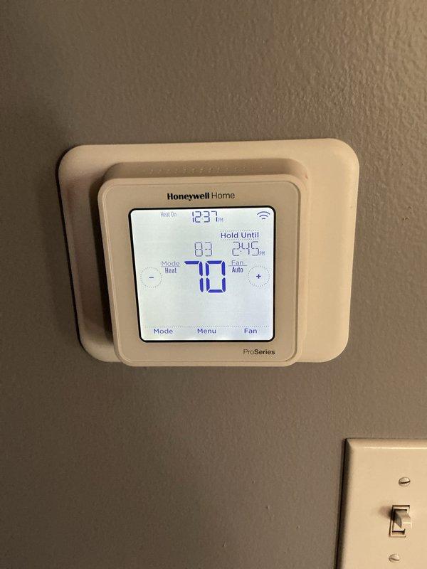 Completed basic monthly heating maintenance visit on CCHP system. Performed standard system inspection and verified Honeywell Home ProSeries thermostat operation, confirming proper heating mode function, schedule following capability, and temperature control at 70°F setpoint. All components operating within normal parameters at time of service.