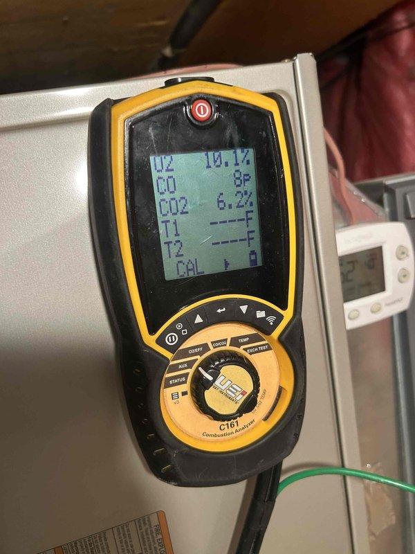 Completed annual basic cooling maintenance visit on residential HVAC system. Performed combustion analysis testing showing readings of H2 14.1%, CO 8ppm, and CO2 6.2%, inspected blower assembly and internal components, and documented moderate dust accumulation on air handler surfaces and filter tracks requiring attention. Customer advised that 20x25x4 filter size is not included in service agreement and maintenance contract renewal is pending.