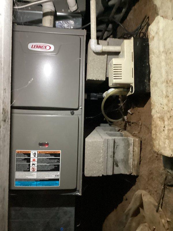 Completed monthly basic heating maintenance visit on Lennox furnace system. Performed standard heating system inspection, replaced 14x20x1 air filter, verified thermostat operation showing 69°F setpoint in cooling mode with auto fan setting, and confirmed all equipment including condensate pump functioning properly with no issues identified.