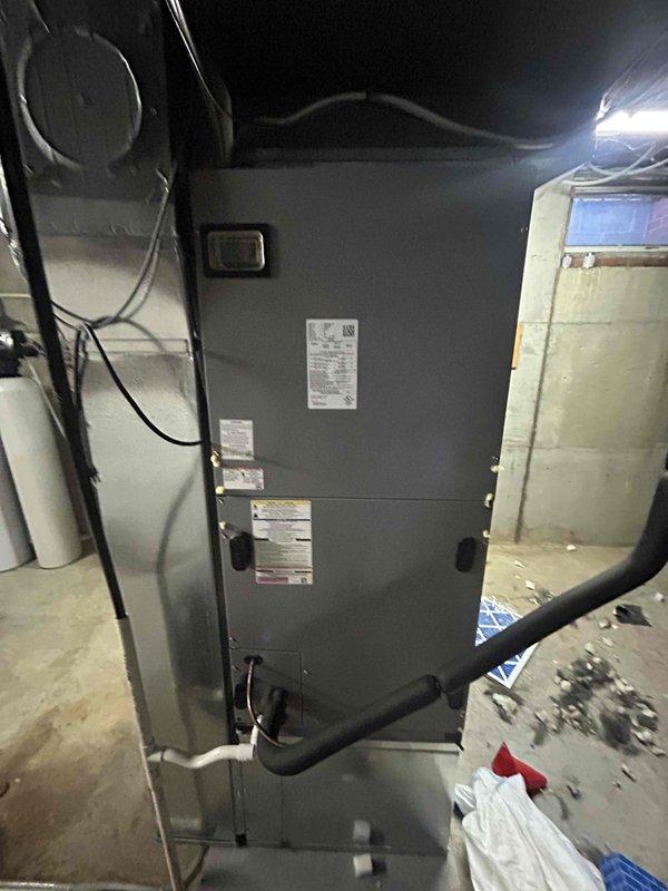Responded to service call for A/C system producing buzzing noise with warm refrigerant outlet line. Inspected air handler unit and verified TXV metering system operation on unit model N41644DXP100. Diagnosed compressor issue causing abnormal noise and improper heat rejection at discharge line, documented unit specifications and current operating conditions with photos for service records.