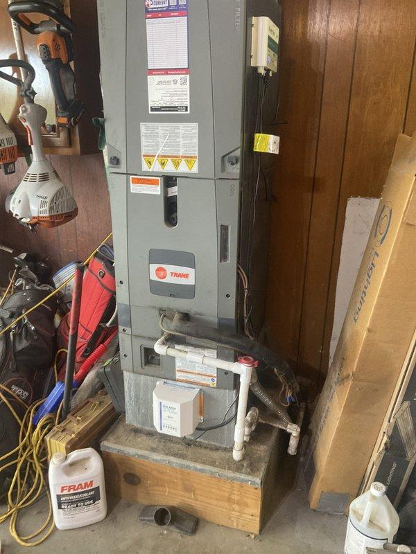 Conducted site evaluation for whole home humidifier installation and assessed existing Trane air handler unit for potential replacement needs. Performed secondary inspection of pole barn structure with no operational heating system to diagnose issue related to recent furnace modifications by homeowner.