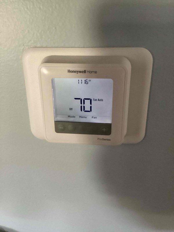 Completed basic monthly heating maintenance visit on residential HVAC system. Performed standard inspection of outdoor condensing unit and verified thermostat operation showing 70 degrees with fan set to auto mode. Unable to document filter size during this visit as location was not accessible or size was not clearly marked; filter size documentation required for future service records.