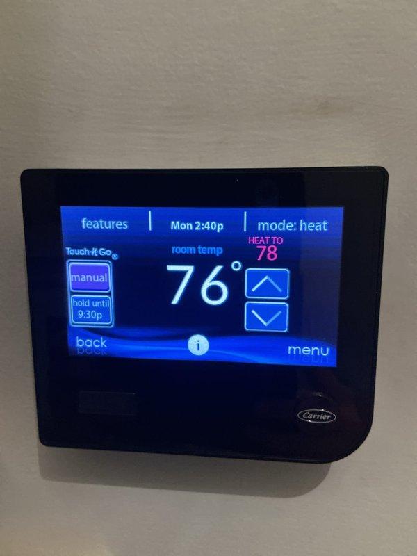 Completed basic monthly HVAC maintenance on heating system. Inspected Carrier thermostat verifying proper operation in heat mode with display showing 76° current temperature and 78° setpoint. Examined blower assembly and confirmed blower wheel fins were clean with proper alignment and electrical connections secure.