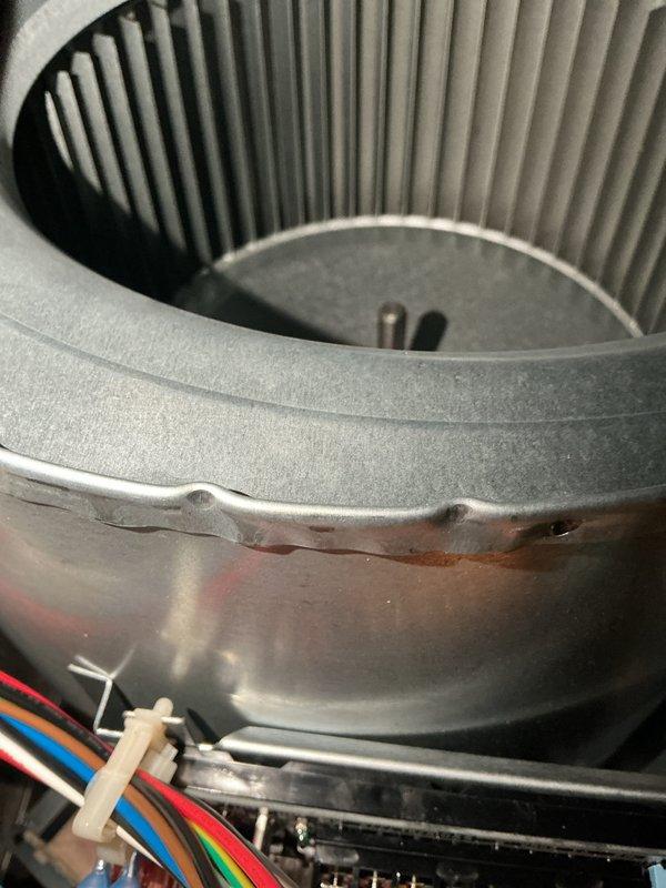 Completed basic monthly HVAC maintenance on heating system. Inspected Carrier thermostat verifying proper operation in heat mode with display showing 76° current temperature and 78° setpoint. Examined blower assembly and confirmed blower wheel fins were clean with proper alignment and electrical connections secure.