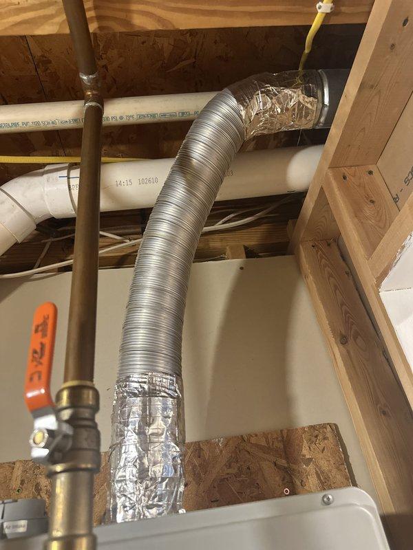 Responded to service call for tankless water heater displaying error code 12. Upon inspection, diagnosed issue with the unit's heating element and flow sensor. Accessed installation location in ceiling cavity between floor joists where unit was mounted alongside existing HVAC ductwork and plumbing lines. Cleared error code, tested water flow and temperature output, and verified proper operation of all safety mechanisms. Unit restored to full functionality with consistent hot water delivery.