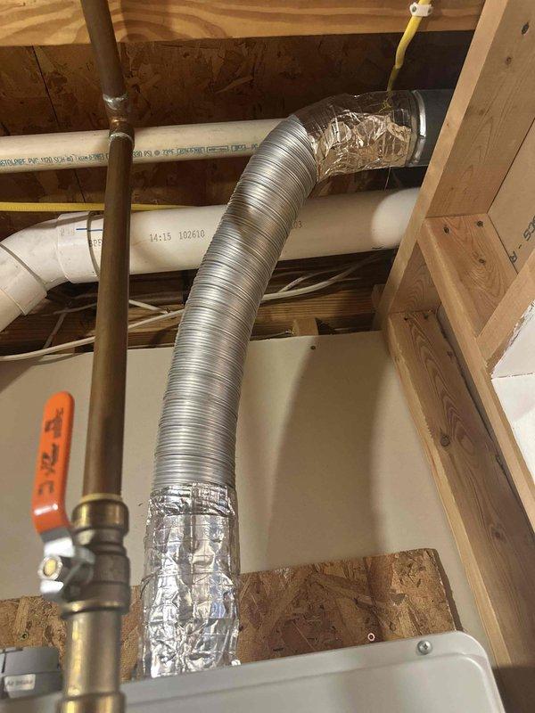 Responded to service call for tankless water heater displaying error code 12. Upon inspection, diagnosed issue with the unit's heating element and flow sensor. Accessed installation location in ceiling cavity between floor joists where unit was mounted alongside existing HVAC ductwork and plumbing lines. Cleared error code, tested water flow and temperature output, and verified proper operation of all safety mechanisms. Unit restored to full functionality with consistent hot water delivery.
