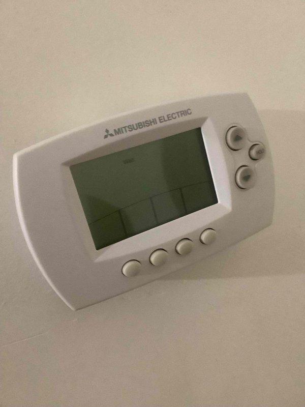 Responded to callback for Mitsubishi Electric mini split system displaying error code and not operating. Upon arrival, inspected unit and Mitsubishi thermostat control, which was previously non-responsive. Performed system diagnostics and cleared error code from controller. Cycled system power and verified thermostat display restored to normal operation showing temperature reading of 76°F. Confirmed all control functions operational and mini split system running properly with no active error codes.